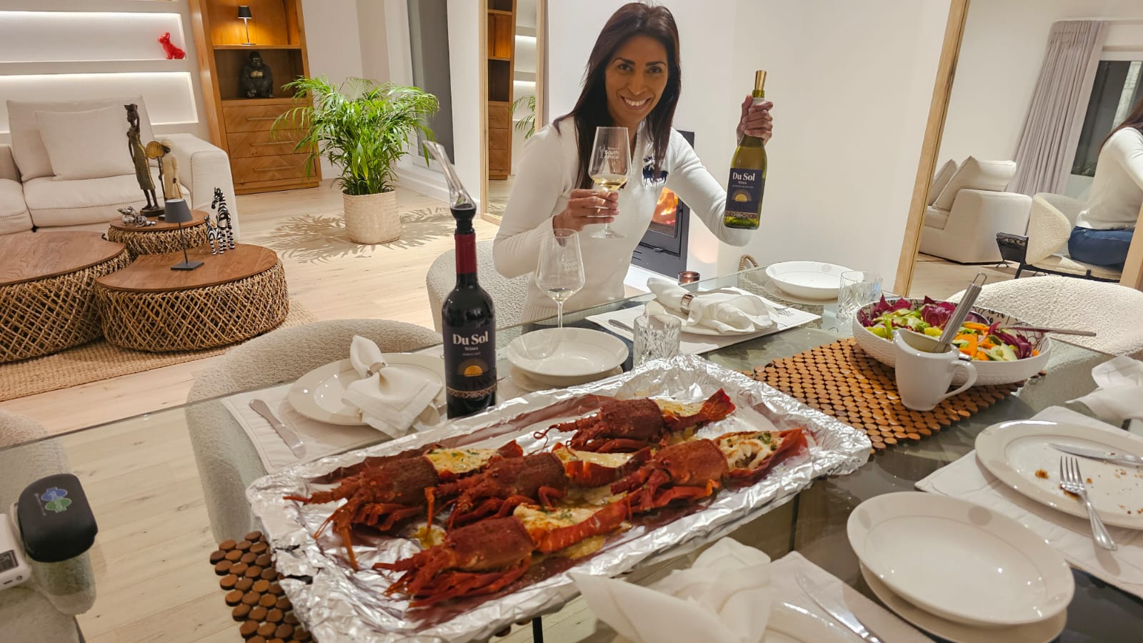 A dinner table set with Du Sol wines and crayfish